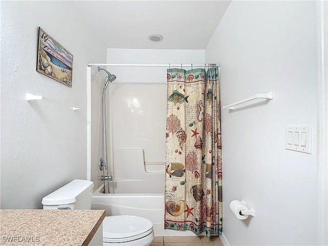 full bathroom with tile patterned floors, shower / bath combo with shower curtain, vanity, and toilet