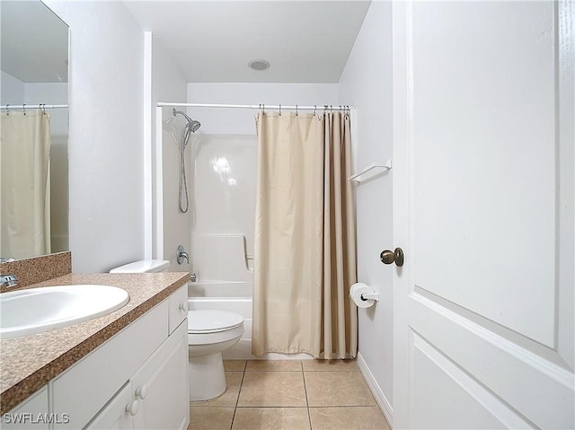 full bathroom featuring tile patterned flooring, vanity, toilet, and shower / tub combo