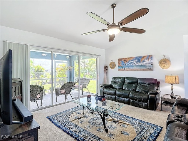 living room with carpet floors, ceiling fan, and lofted ceiling