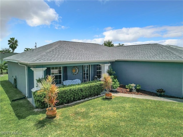 ranch-style home featuring a front yard