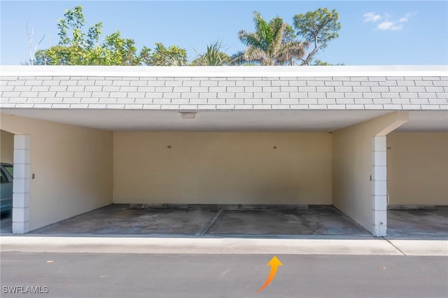 view of vehicle parking featuring a carport