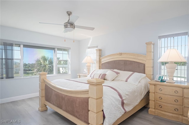 bedroom featuring dark hardwood / wood-style flooring and ceiling fan