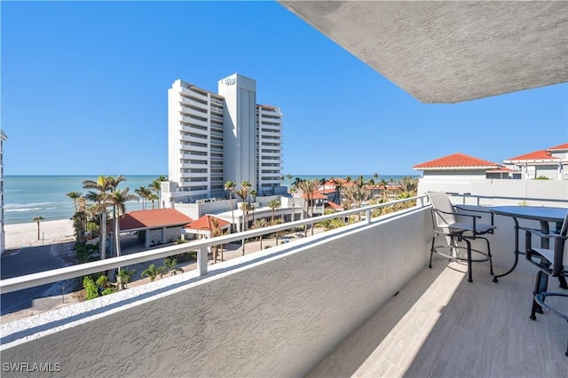 balcony featuring a water view