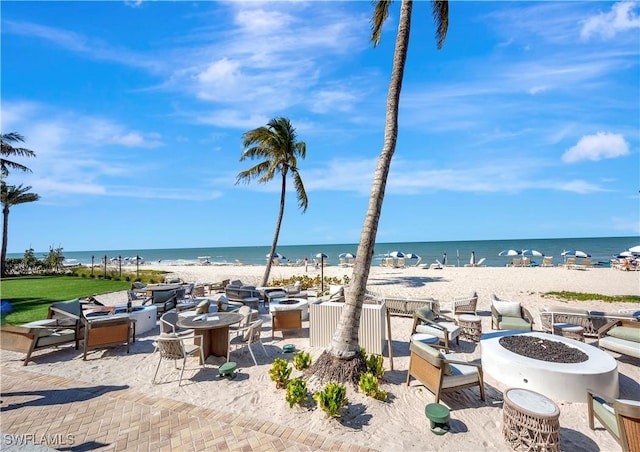 property view of water featuring a beach view and a fire pit