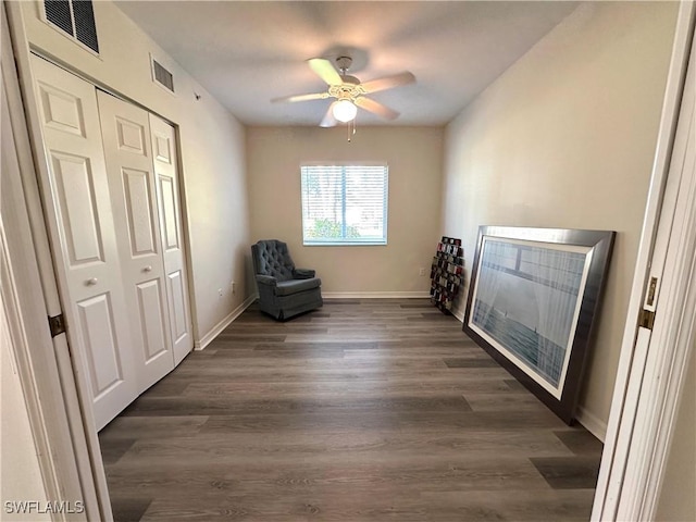 unfurnished room featuring ceiling fan and dark hardwood / wood-style flooring