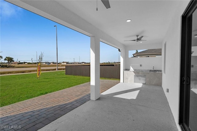 view of patio / terrace with ceiling fan