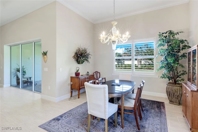 dining area featuring baseboards, crown molding, and a notable chandelier