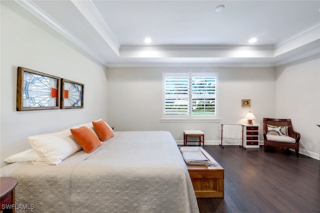 bedroom with a tray ceiling, crown molding, wood finished floors, baseboards, and recessed lighting
