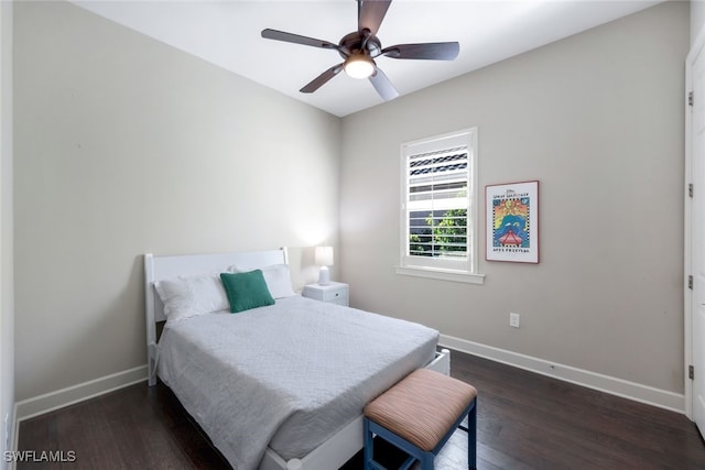 bedroom featuring ceiling fan and dark wood-type flooring