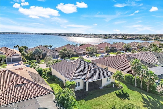 aerial view featuring a residential view and a water view