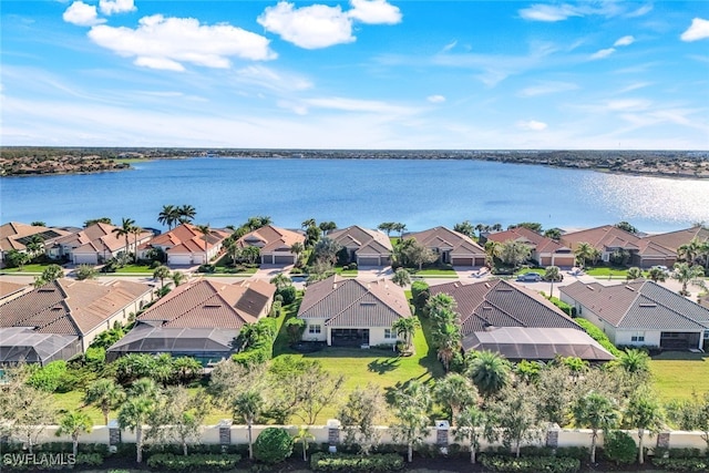 bird's eye view with a residential view and a water view