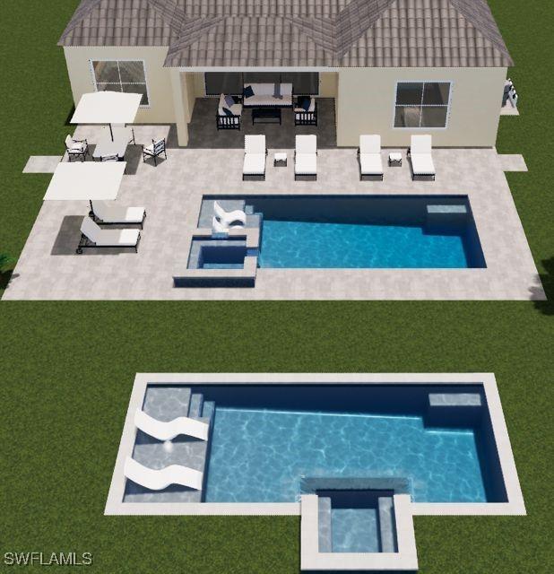 view of swimming pool featuring a lawn, a pool with connected hot tub, and a patio area
