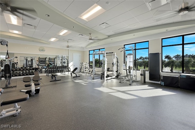 workout area featuring a drop ceiling and ceiling fan