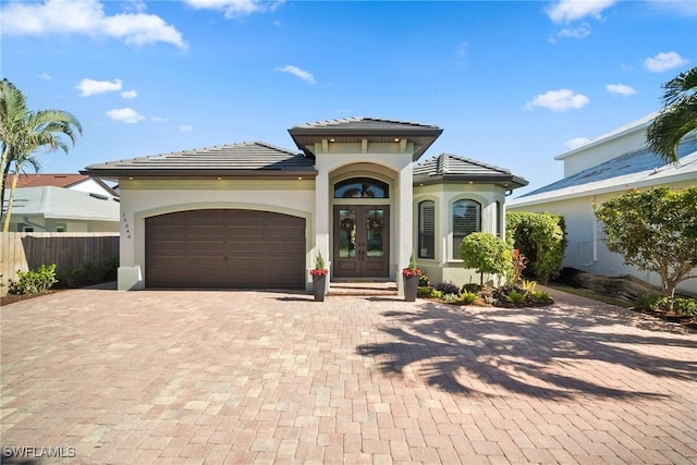 view of front of house featuring french doors and a garage