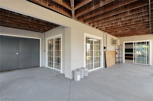 view of patio with a wall mounted AC