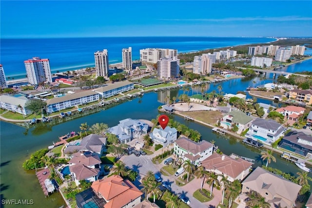 birds eye view of property featuring a water view