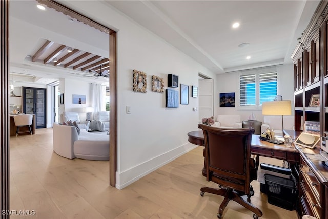 office space with light wood-type flooring