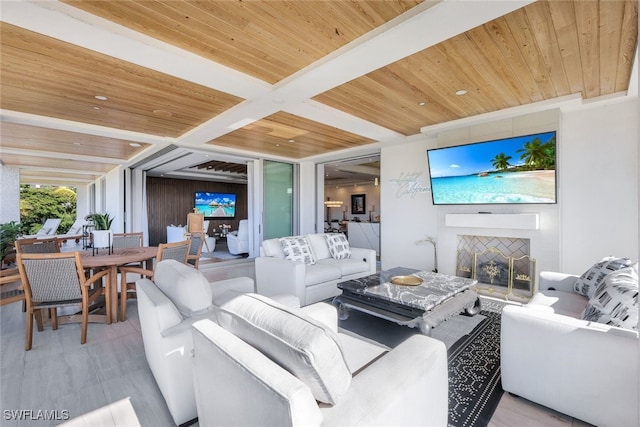 living room with beamed ceiling, light hardwood / wood-style floors, and wooden ceiling