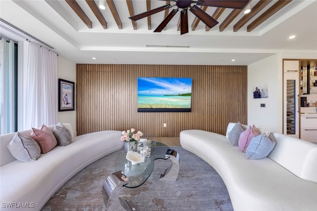 bedroom with beamed ceiling and ceiling fan