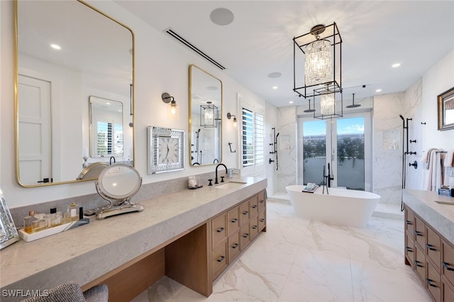 bathroom with plus walk in shower, plenty of natural light, and vanity