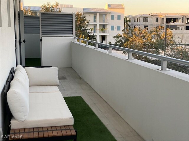 view of balcony at dusk