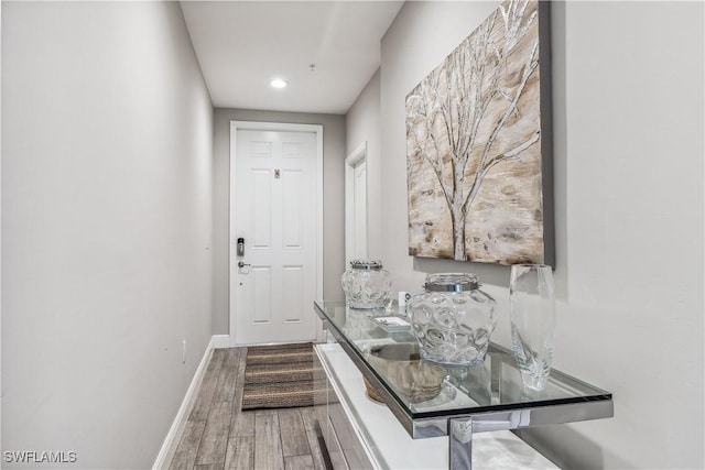 corridor featuring hardwood / wood-style flooring