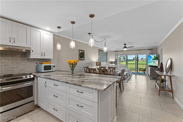 kitchen featuring stainless steel range with electric cooktop, white cabinets, ceiling fan, tasteful backsplash, and kitchen peninsula