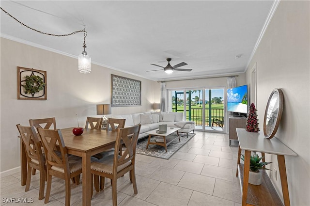 dining room featuring ceiling fan, light tile patterned flooring, and ornamental molding