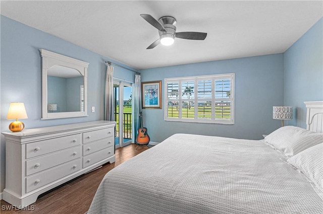 bedroom featuring access to exterior, ceiling fan, and dark wood-type flooring