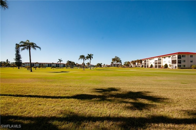 surrounding community featuring a lawn