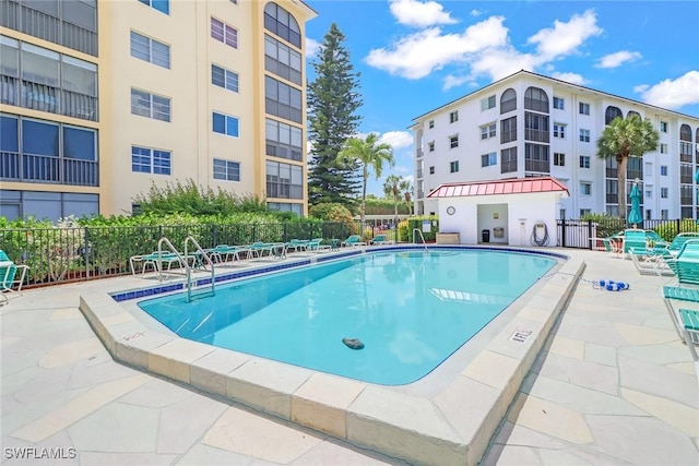 view of swimming pool with a patio area