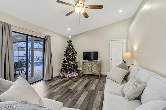 living room featuring dark hardwood / wood-style floors, ceiling fan, and lofted ceiling