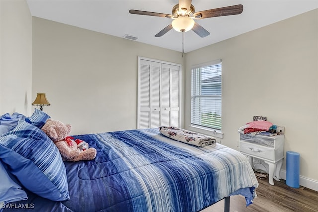 bedroom with a closet, ceiling fan, and hardwood / wood-style floors