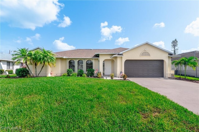 ranch-style house featuring a front yard and a garage