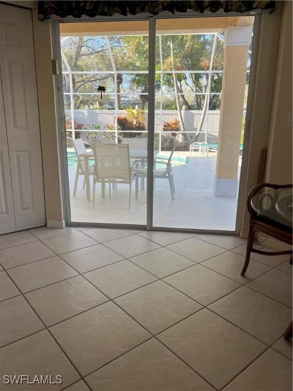 doorway with tile patterned flooring