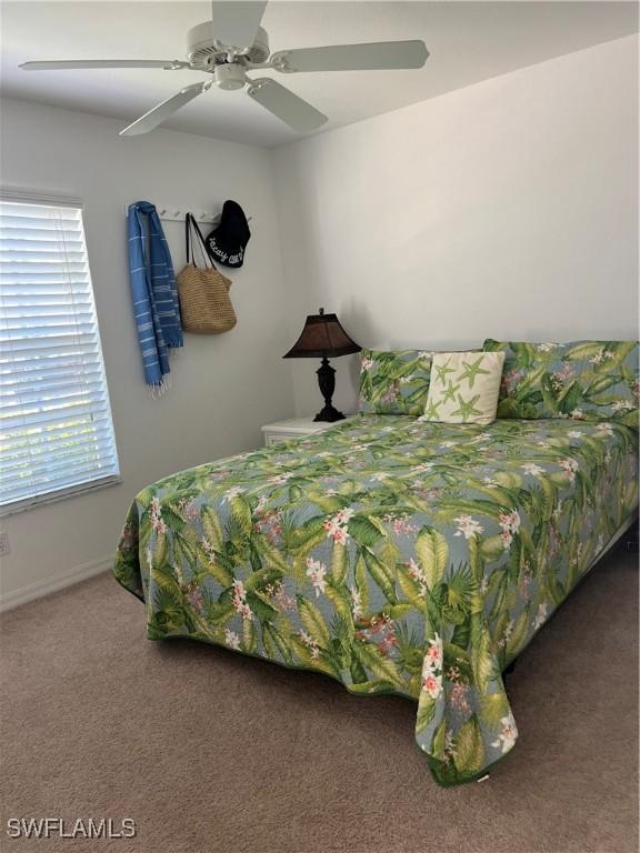 bedroom featuring ceiling fan and carpet floors