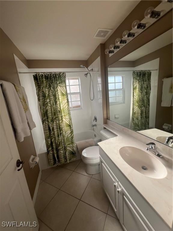 full bathroom with tile patterned floors, vanity, toilet, and shower / tub combo with curtain