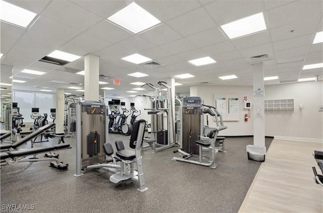 gym featuring a drop ceiling