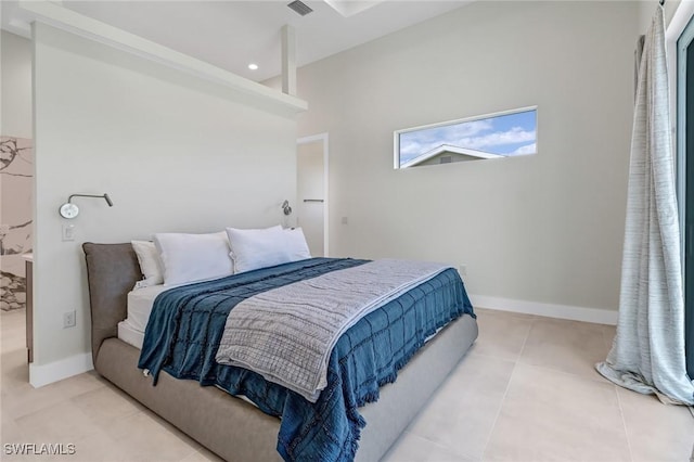 tiled bedroom featuring recessed lighting and baseboards