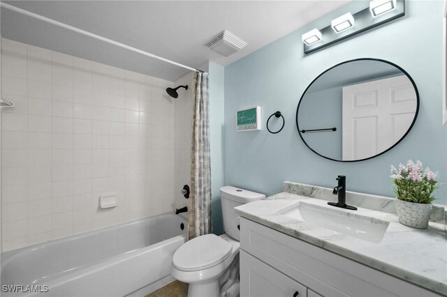 full bathroom featuring vanity, shower / bath combination with curtain, and toilet