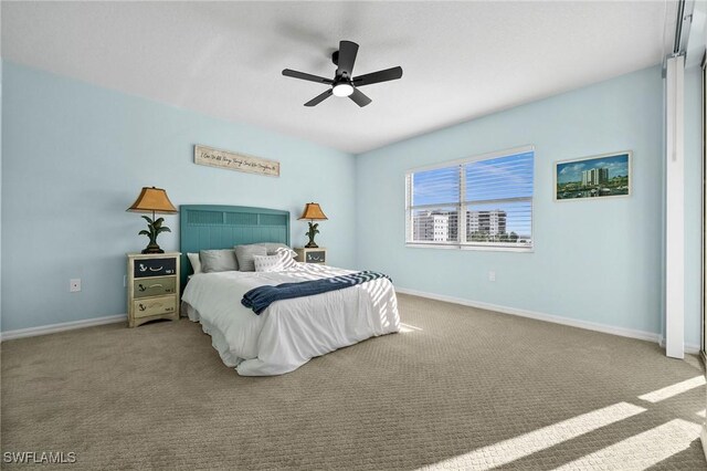 bedroom with ceiling fan and light colored carpet