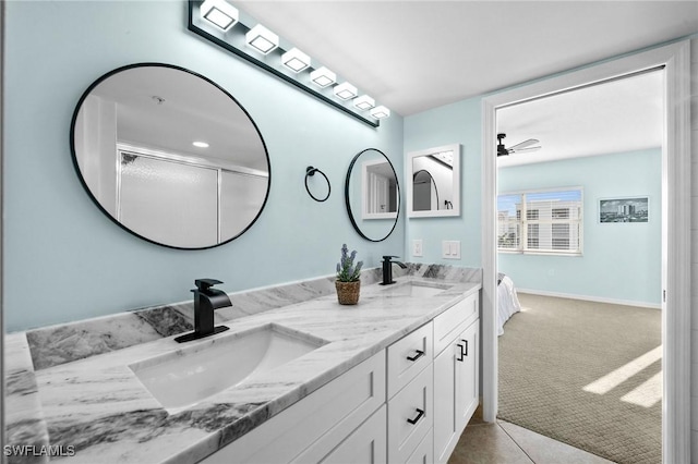 bathroom featuring tile patterned floors, ceiling fan, and vanity