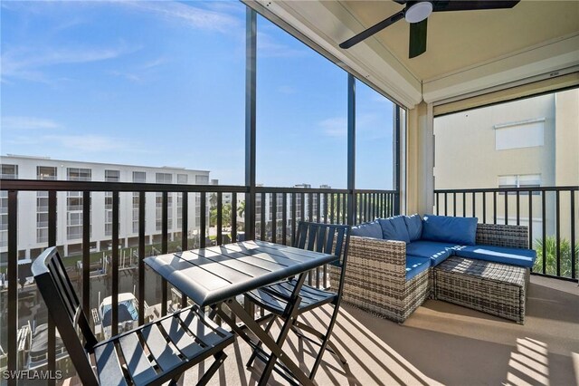 sunroom featuring ceiling fan