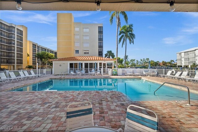 view of swimming pool with a patio area