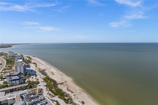 drone / aerial view with a beach view and a water view