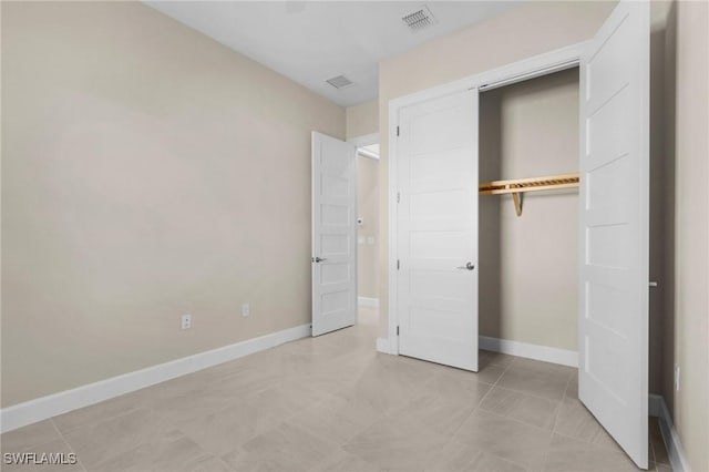 unfurnished bedroom featuring a closet