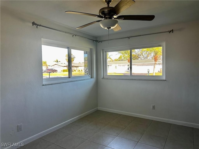 unfurnished room featuring light tile patterned flooring and ceiling fan