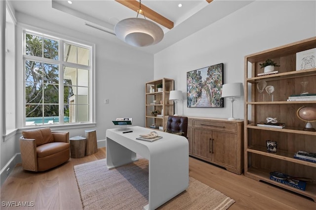 office space with light wood-type flooring