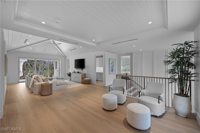 living room with wooden ceiling, light hardwood / wood-style flooring, and lofted ceiling with beams