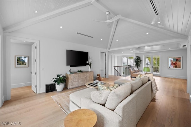 living room with ceiling fan, light hardwood / wood-style flooring, and vaulted ceiling with beams